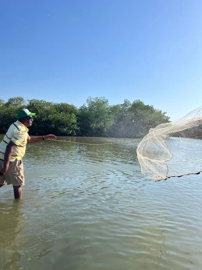 Cartagena: Mangrove Eco Tour & Fishing with Transportation - Your guides, the welcome drink, and the community vibe