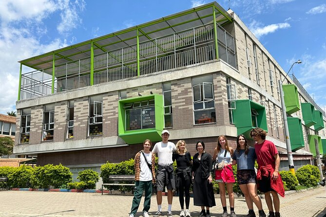 Comuna 4 Walking Tour Medellin - Stop 4: cigarreria la plaquita and football graffiti as identity