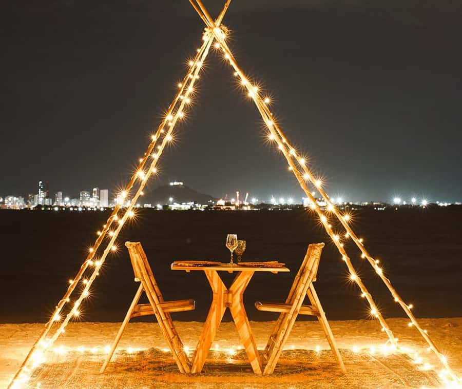 Fenix Beach Island Dinner - The arrival moment: the private dock, mandalas, and the bonfire setup