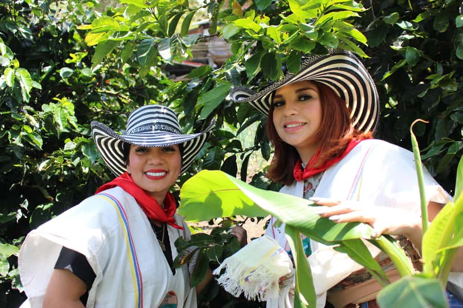 Medellin: Coffee Tour with Hotel Transfers and Meals - The welcome and traditional outfit moment that actually makes photos worth it