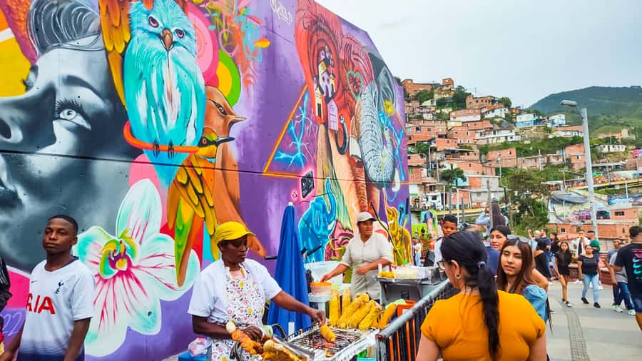 Medellin: Comuna 13 Graffiti Tour, Cable Car & Street Food - Walking Comuna 13: murals, art clothing, and street corners with meaning