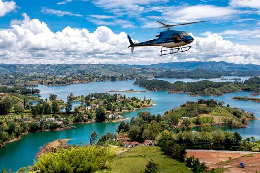 Medellín: Guatapé Private Tour with Helicopter & Boat Ride - Guatapé Town Walk and the Zócalos You’ll Actually Notice