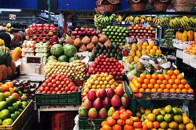 Private Paloquemao Market Tour: +20 Fruit & Treats Tasting • 3h - Stop 1: Plaza de Mercado Paloquemao flower market scents and color cues