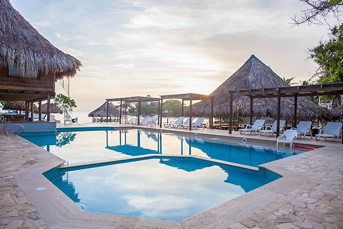 Rosario Islands Day Trip: Snorkel & Sunbathe at Isla del Sol - Beach time on a small private shoreline, with shade and limited sun beds