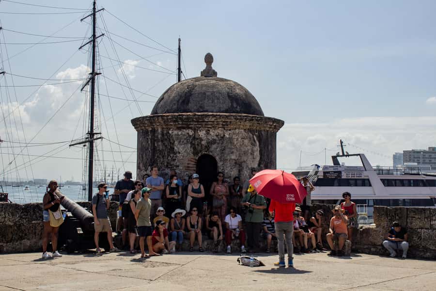 Shared Old Cartagena & Getsemani Tour with Wireless System - San Pedro Claver and Plaza de la Aduana: Cartagena’s Serious Side