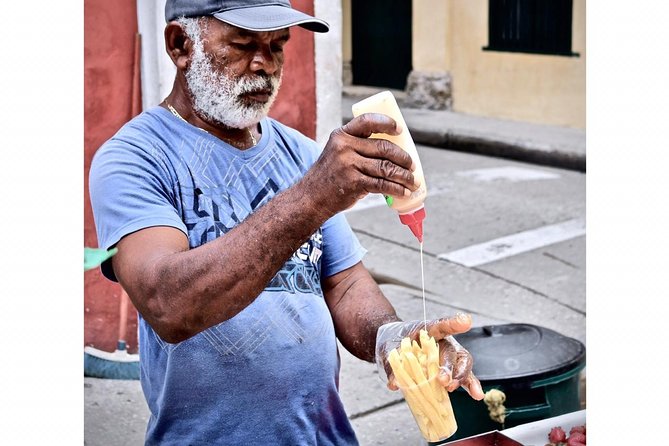 Street Food Tour in Cartagena Walled City and Getsemani - Plaza Stops and Photo Walks: Trinidad, Santo Domingo, San Pedro Claver, and Las Bóvedas