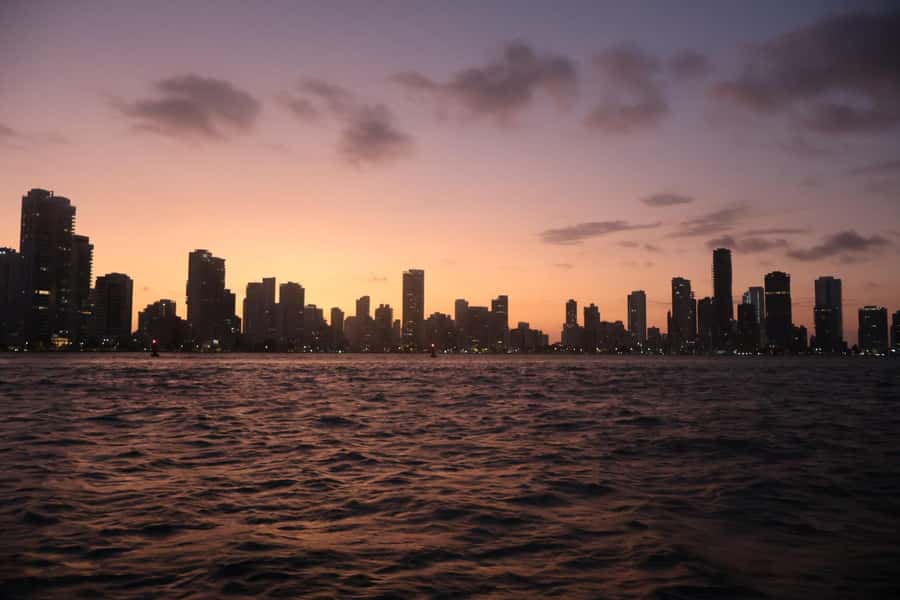 Sunset Party open bar on the bay while sharing with locals - Pegasus Pier to the water: where the party starts